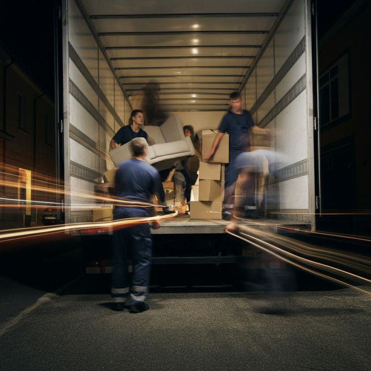 Crew loading boxed systems into a truck