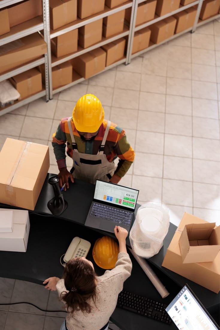 Order intake desk with laptop and packages